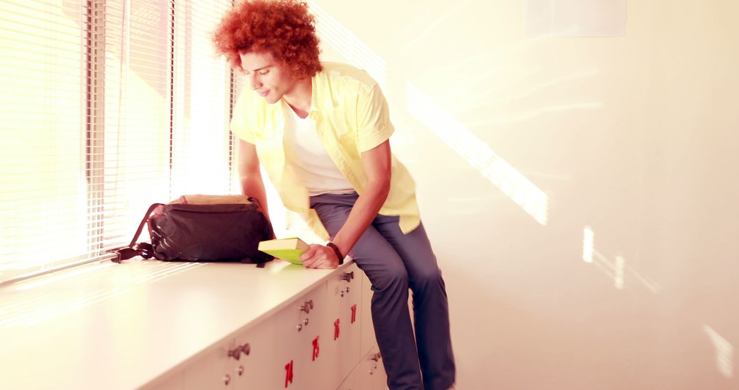 University Student Sitting on Lockers on Sunny Day