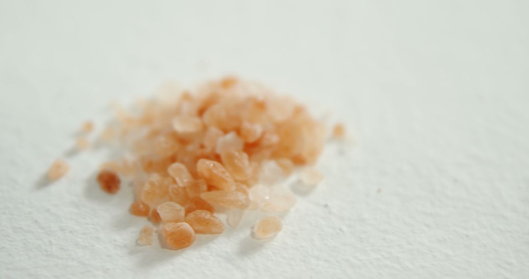 Close-up of Himalayan Pink Salt Crystals on White Background - Free Images, Stock Photos and Pictures on Pikwizard.com