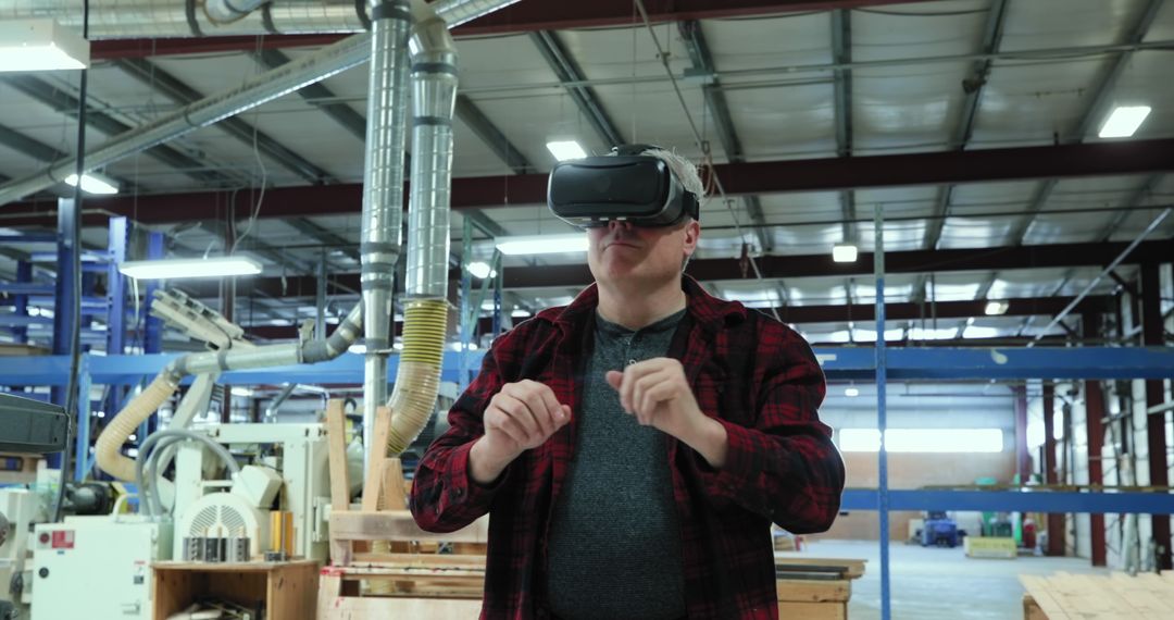 Factory Worker Exploring VR Technology in Industrial Setting - Free Images, Stock Photos and Pictures on Pikwizard.com