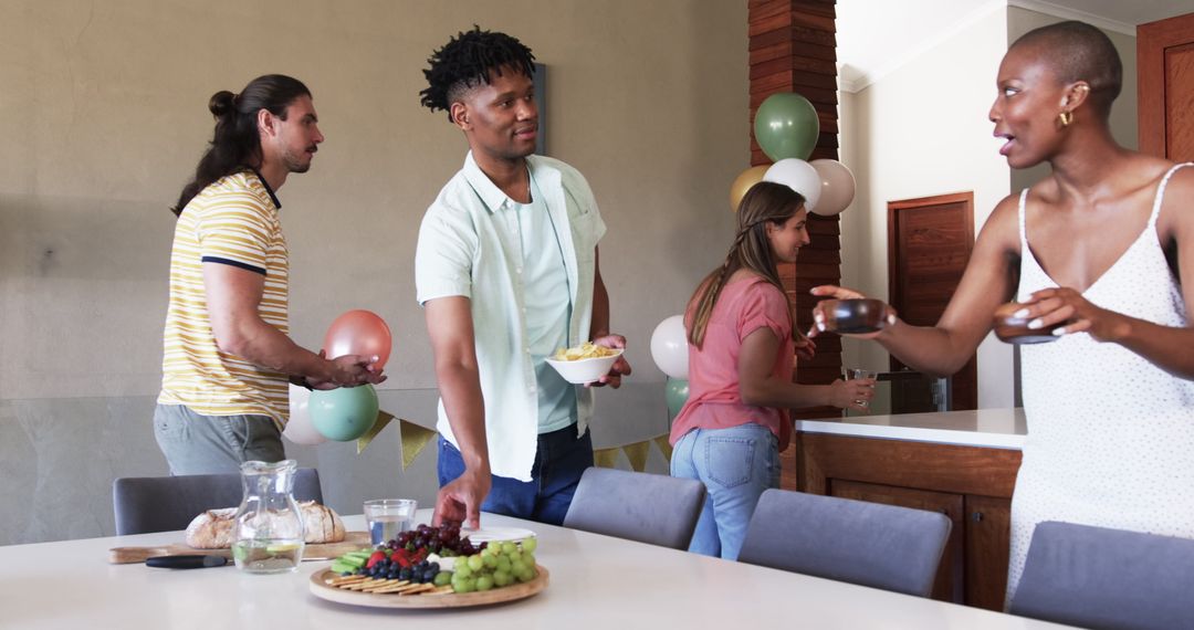 Friends Socializing with Snacks and Drinks at Lively Home Gathering