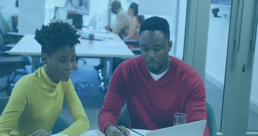 Professional Team Working Together at Office Meeting Table
