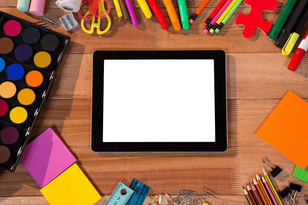 Transparent Digital Tablet Surrounded by Creative Stationery Items