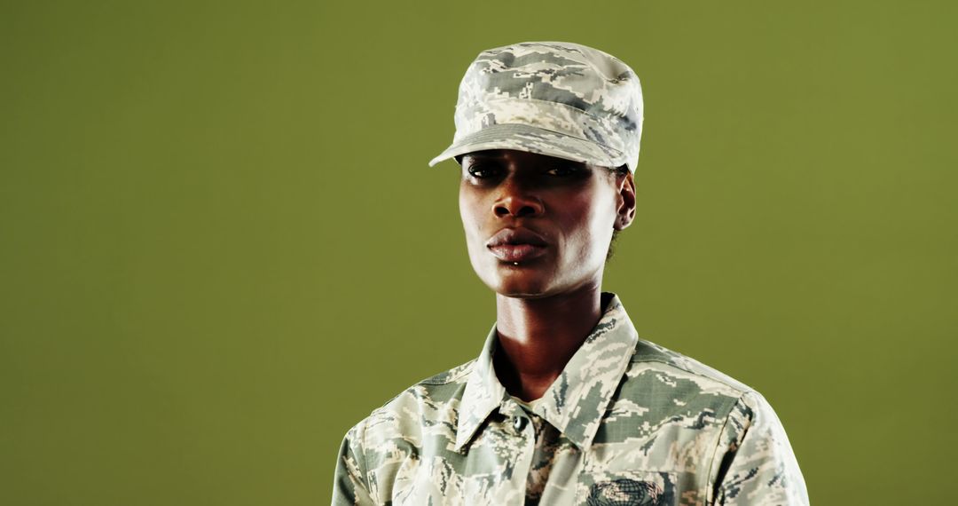 Confident Female Soldier in Camouflage Uniform - Free Images, Stock Photos and Pictures on Pikwizard.com