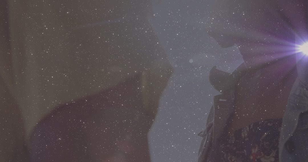 Cinematic Reunion Under Starlit Sky with Mysterious Lens Flare