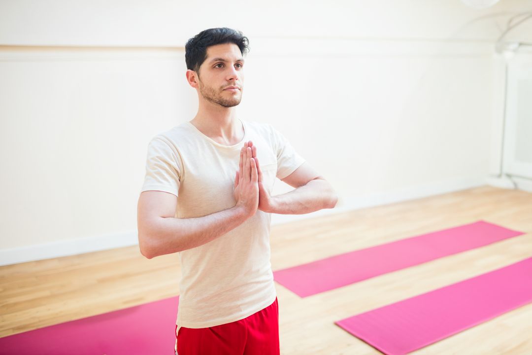 Man Practicing Yoga in Serenity of Minimalist Studio