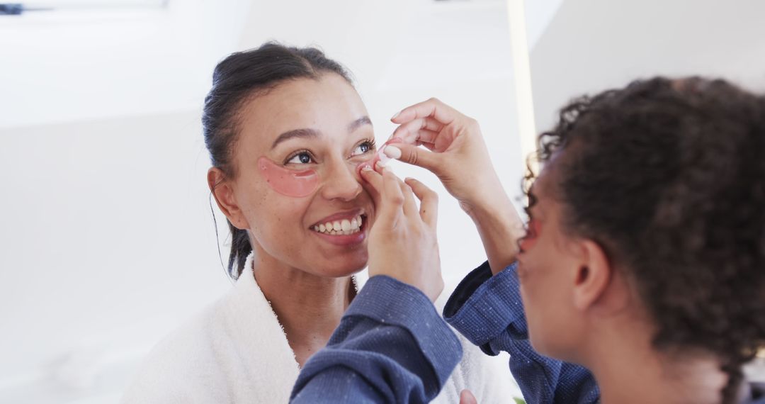 Women Applying Under-Eye Patches In Bathroom, Morning Skincare Routine - Free Images, Stock Photos and Pictures on Pikwizard.com