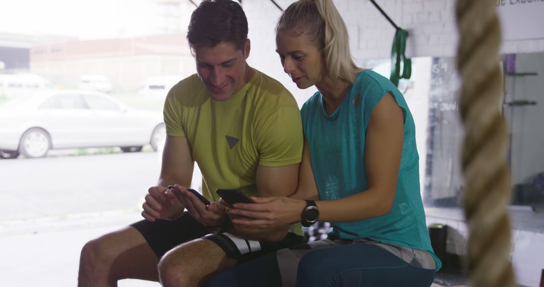 Fitness Enthusiasts Checking Workout Progress on Phones - Free Images, Stock Photos and Pictures on Pikwizard.com