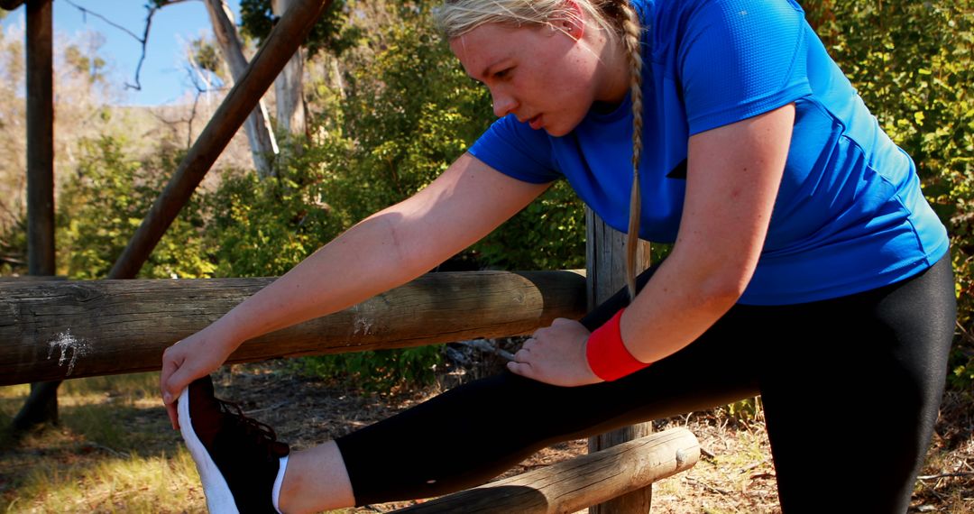 Woman Stretching Outdoors in Athletic Gear - Free Images, Stock Photos and Pictures on Pikwizard.com