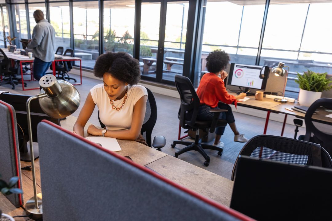 Professional Team Working Collaboratively in Modern Open-Plan Office