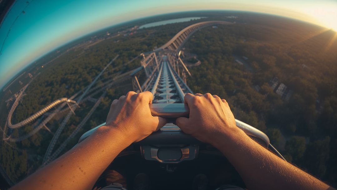 Hands Gripping Roller Coaster Safety Bar with Thrill Ride View