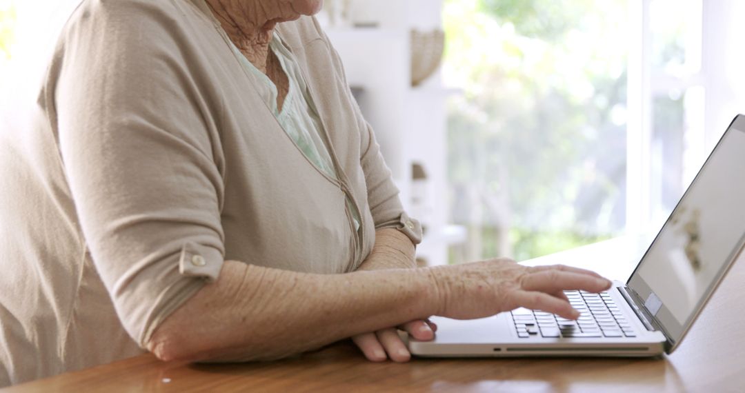 Senior Woman Using Laptop at Home - Free Images, Stock Photos and Pictures on Pikwizard.com