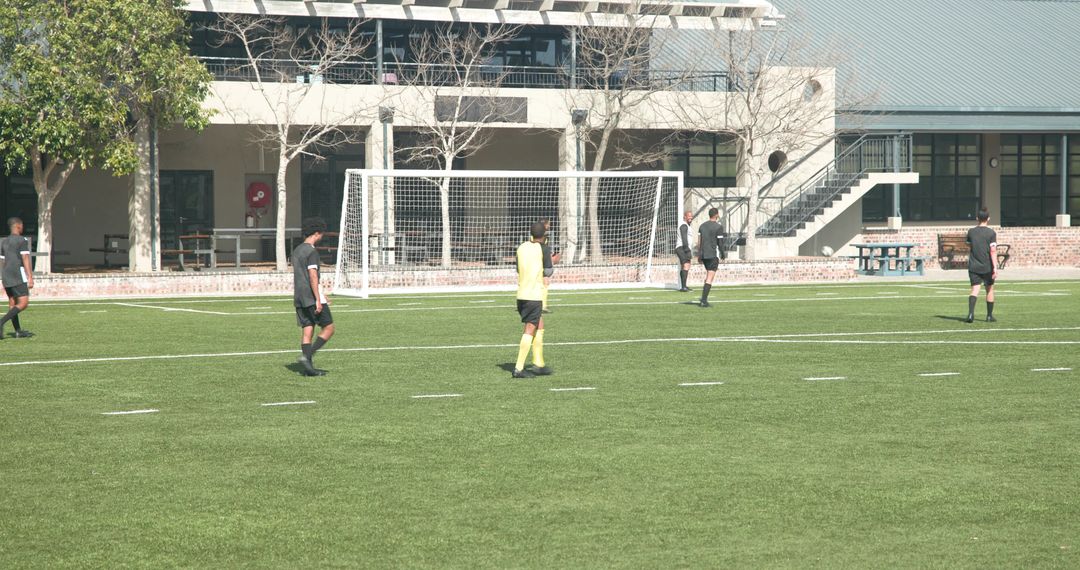 Soccer Team Practicing on Field Displaying Teamwork and Strategy