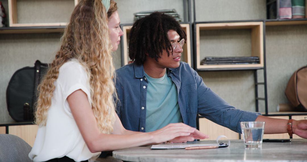 Project Collaboration at Modern Office Desk: Diverse Professional Teamwork