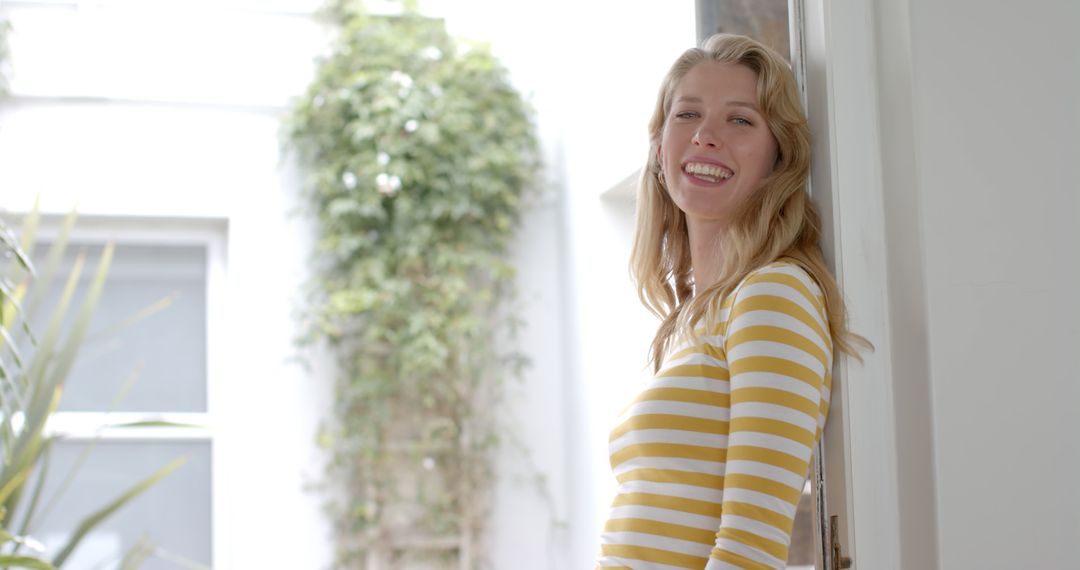 Happy Blonde Woman Smiling Outdoors in Casual Striped Outfit - Free Images, Stock Photos and Pictures on Pikwizard.com