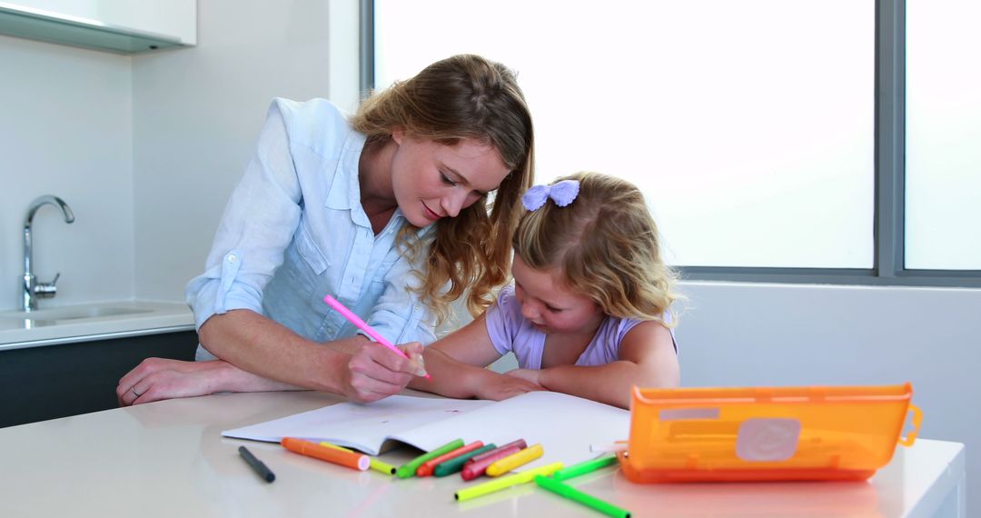 Mother Helping Daughter with Homework in Bright Kitchen - Free Images, Stock Photos and Pictures on Pikwizard.com