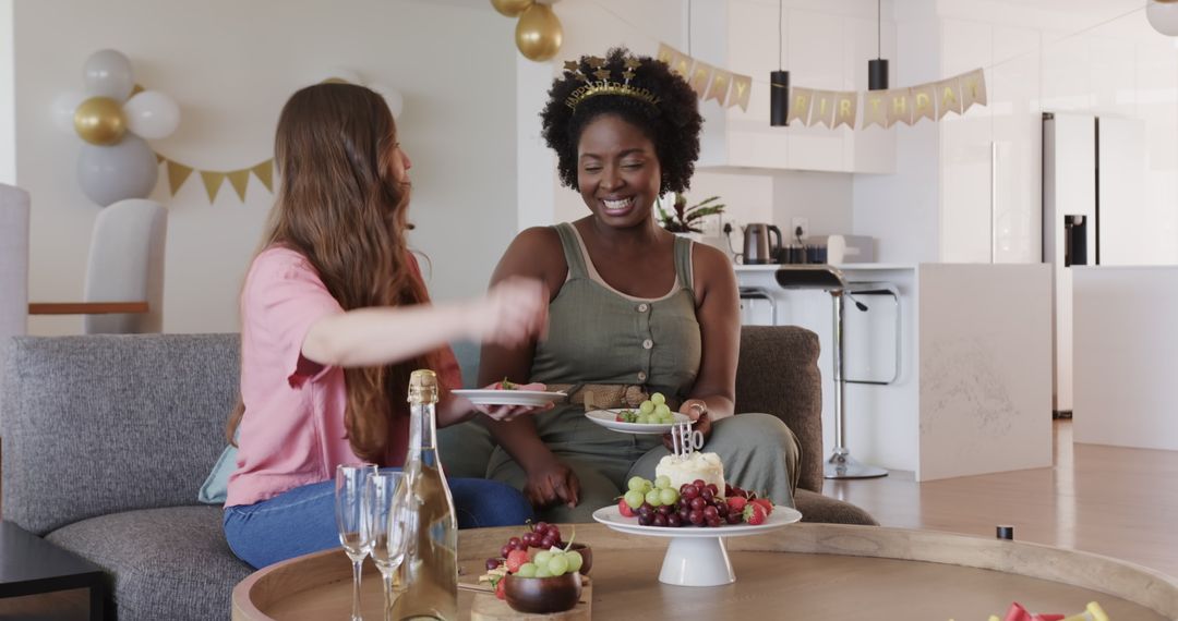 Happy Lesbian Couple Celebrating Birthday at Home