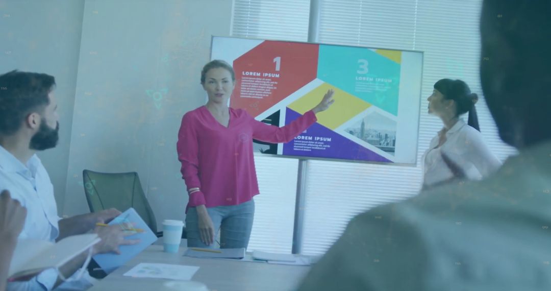 Diverse Team Analyzing Data With Digital Overlay in Office Meeting