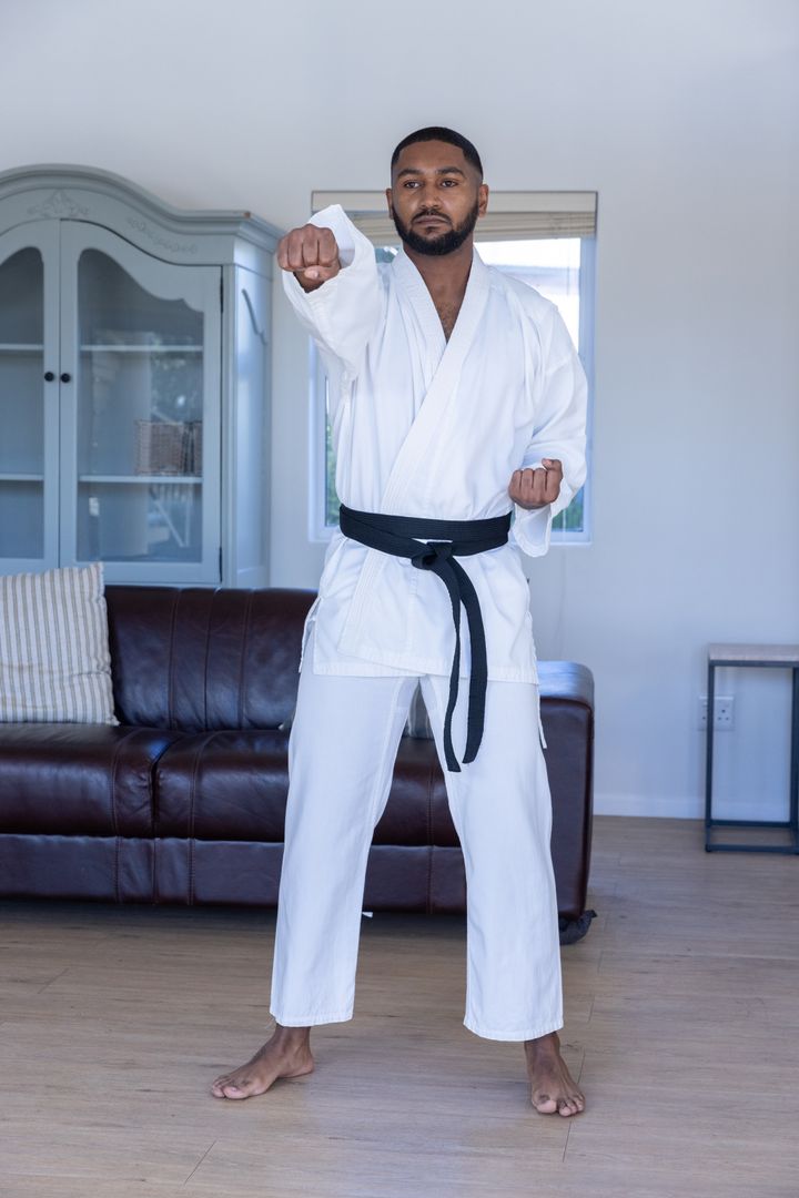 Martial Artist Practicing Punch Technique at Home