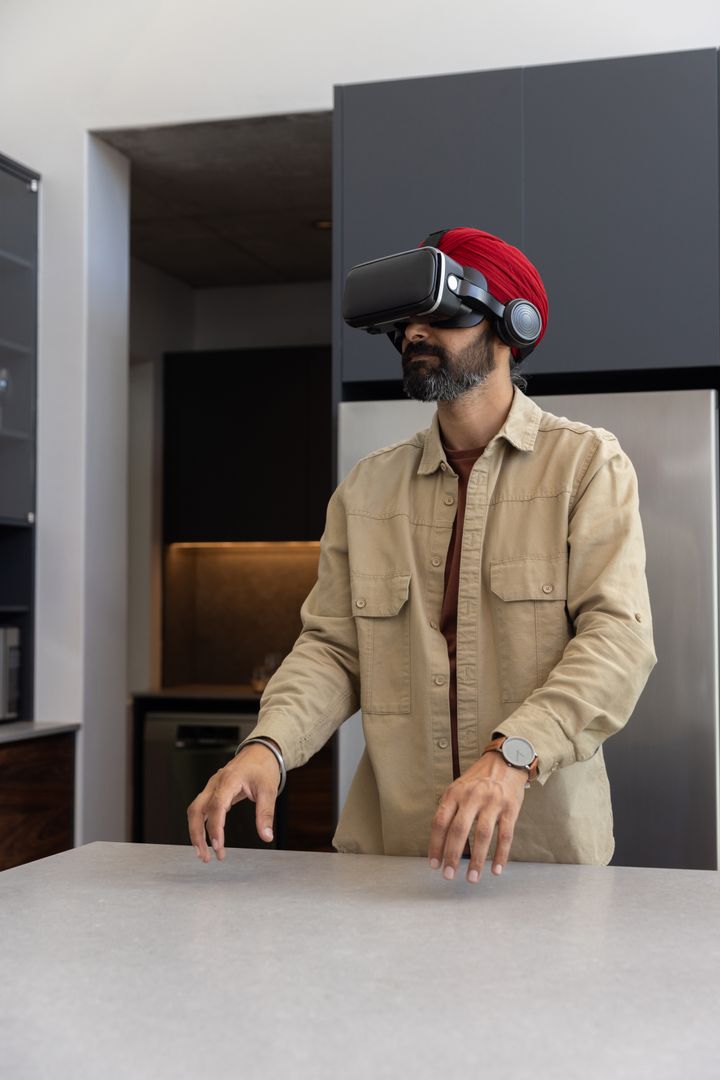 Man Experiencing Virtual Reality in Modern Kitchen