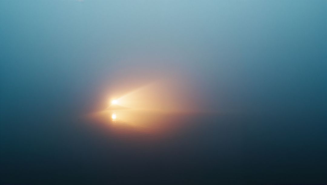 Mysterious Fog-Diffused Light Orb Reflecting on Misty Water