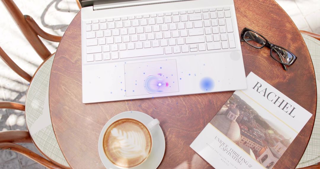Outdoor Cafe Table with Laptop and Latte in Relaxed City Setting