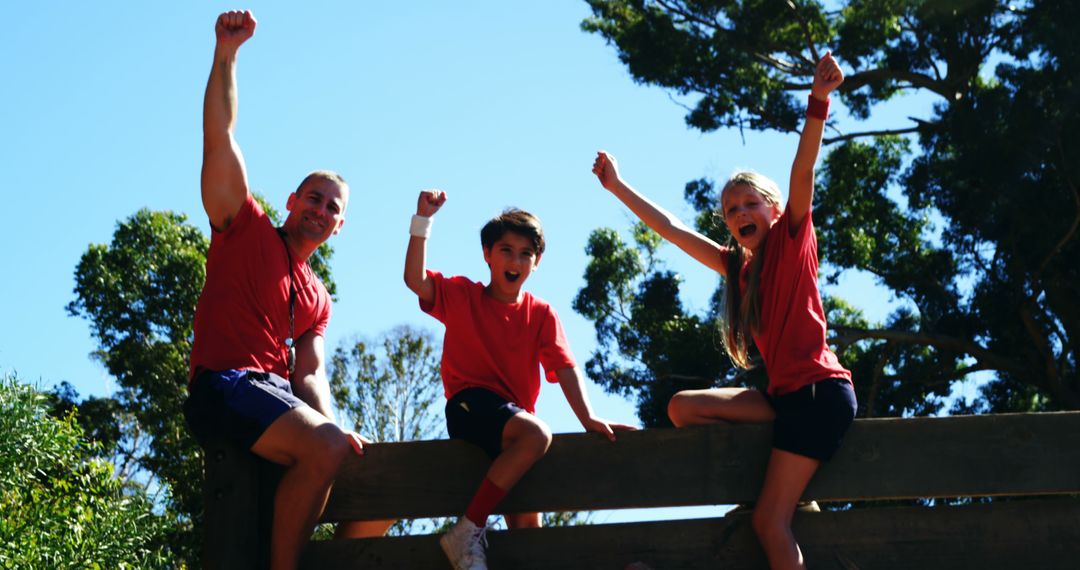 Family Cheering on Wooden Fence in Outdoor Setting - Free Images, Stock Photos and Pictures on Pikwizard.com