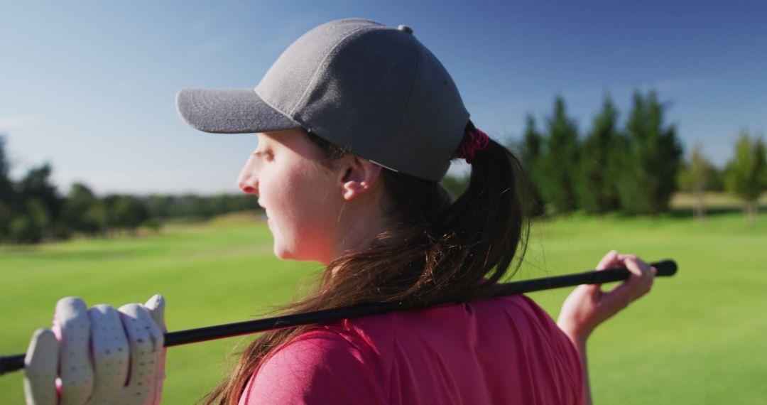 Woman Golfer Relaxing on Green Holding Golf Club - Free Images, Stock Photos and Pictures on Pikwizard.com