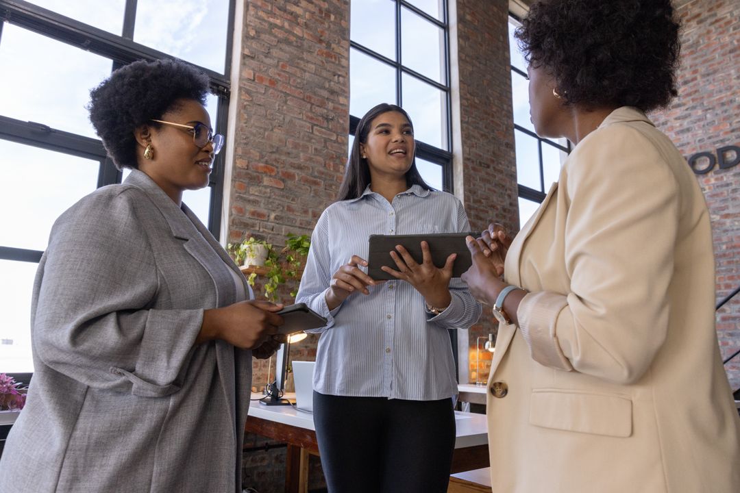 Diverse Team Having Office Meeting Discussing on Digital Devices