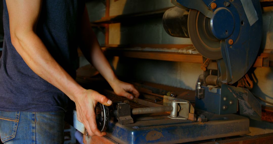 Man Operating Industrial Bandsaw in Workshop - Free Images, Stock Photos and Pictures on Pikwizard.com