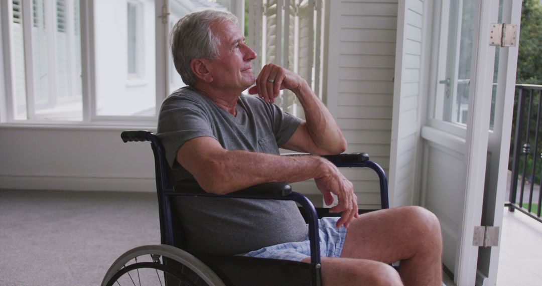 Pensive Senior Man Sitting in Wheelchair by Window - Free Images, Stock Photos and Pictures on Pikwizard.com