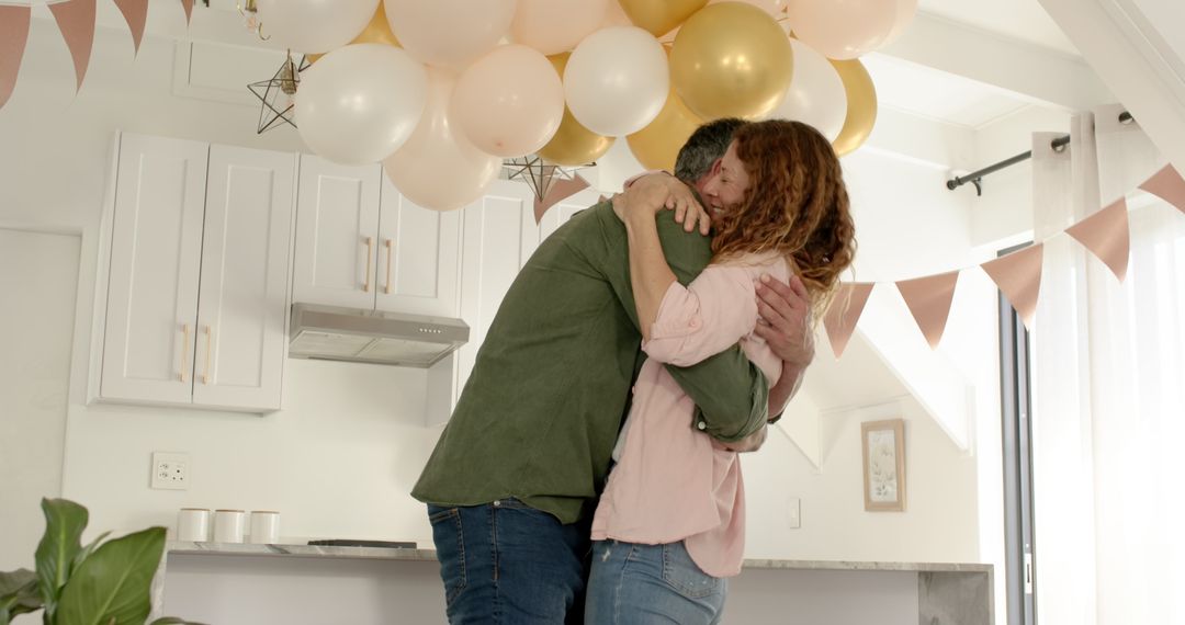 Couple Celebrating Engagement in Decorated Home Kitchen
