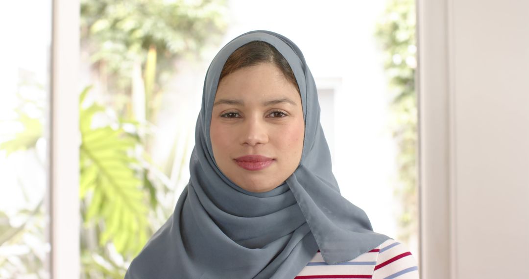 Confident Young Woman in Hijab with Light Gray Background - Free Images, Stock Photos and Pictures on Pikwizard.com