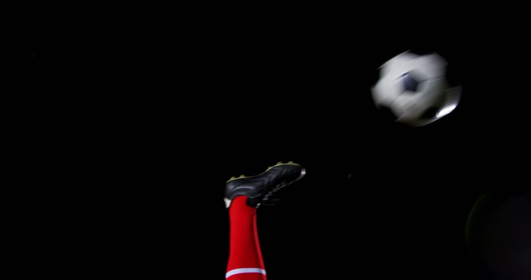 Soccer Player Performing Spectacular Bicycle Kick against Black Background - Free Images, Stock Photos and Pictures on Pikwizard.com