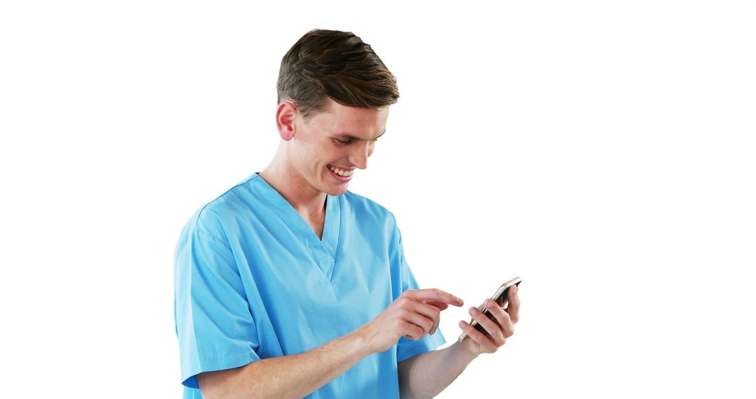 Male Nurse Smiling and Using Smartphone in Blue Scrubs - Free Images, Stock Photos and Pictures on Pikwizard.com