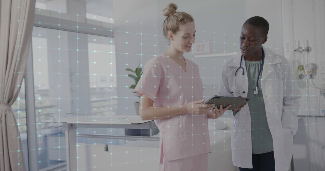 Medical Professionals Analyzing Patient Data on Tablet in Hospital - Free Images, Stock Photos and Pictures on Pikwizard.com