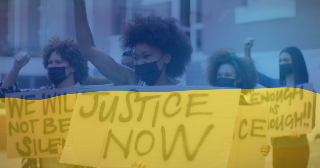 Protesters in Face Masks Against Ukrainian Flag Backdrop