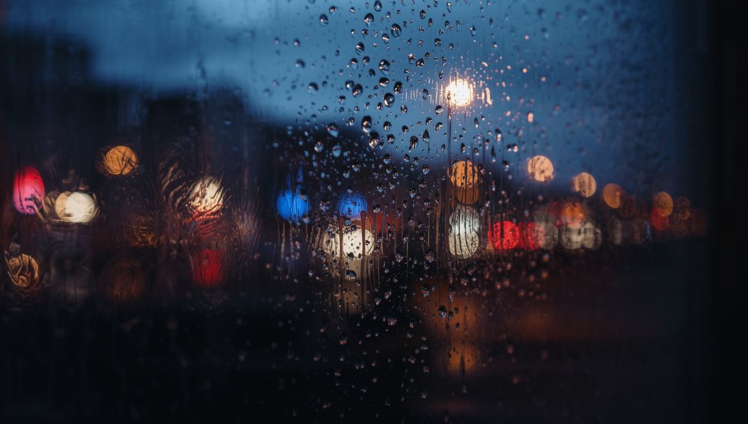 Rainy Night Bokeh Lights Reflected on Glass