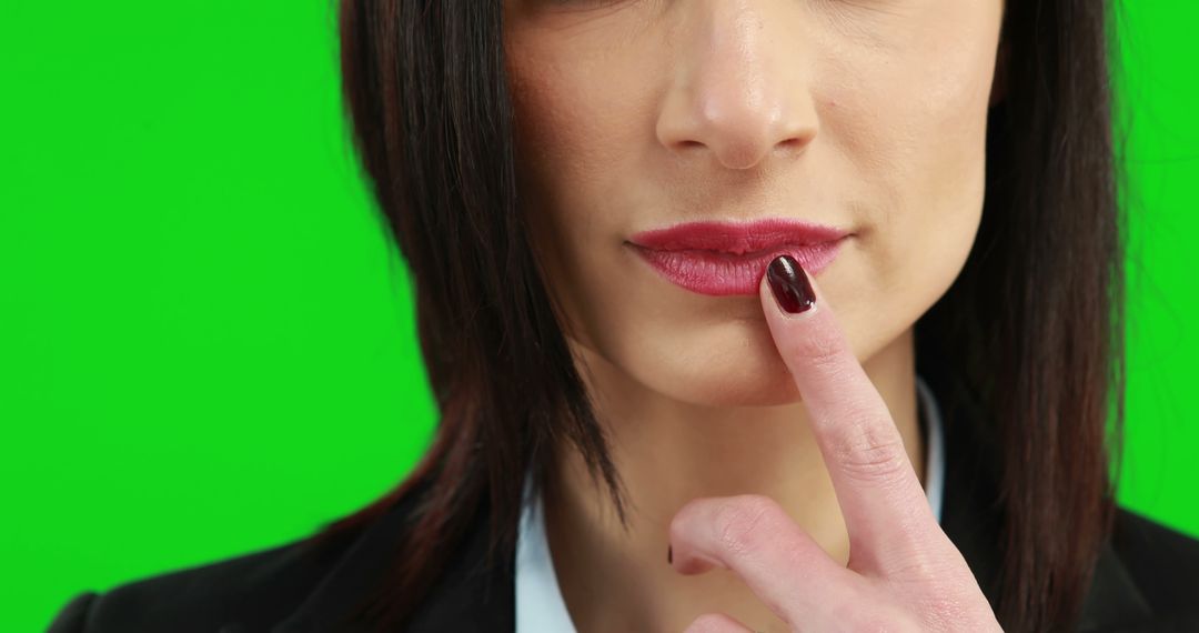 Woman Touching Lips Thoughtfully Green Screen Background - Free Images, Stock Photos and Pictures on Pikwizard.com