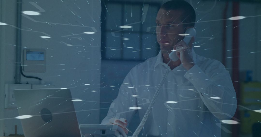 Professional in Office Analyzing Data on Laptop