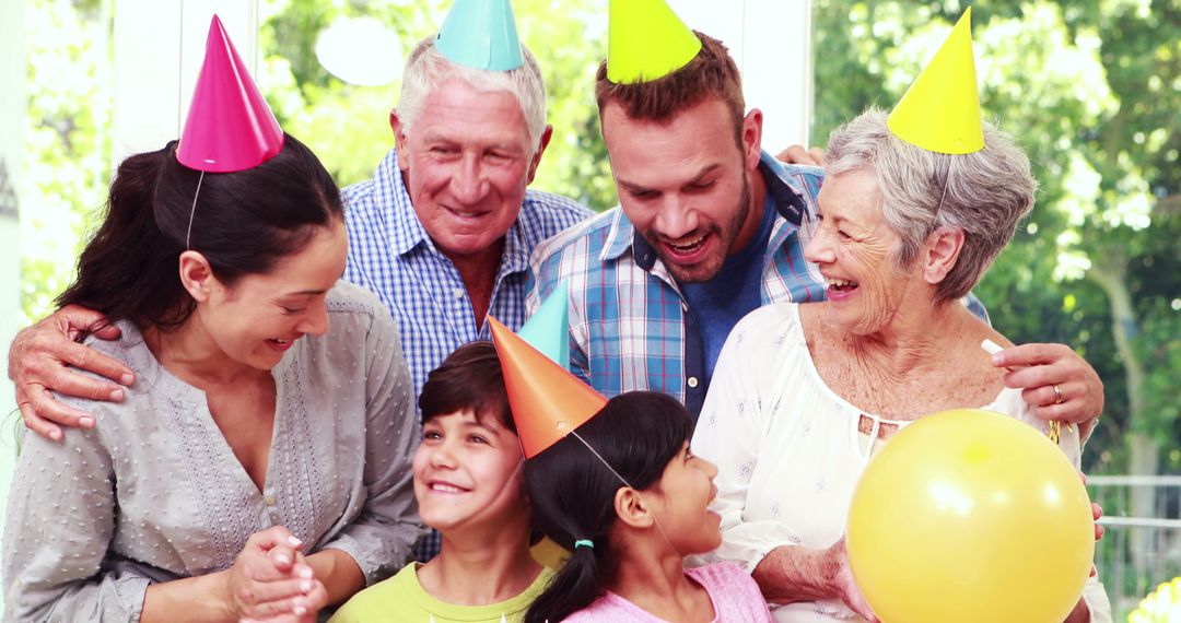 Joyful Multigenerational Family Celebrating Birthday with Laughter - Free Images, Stock Photos and Pictures on Pikwizard.com