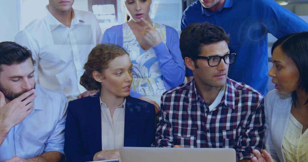 Team Collaborating on Project Ideas with Laptop in Modern Office