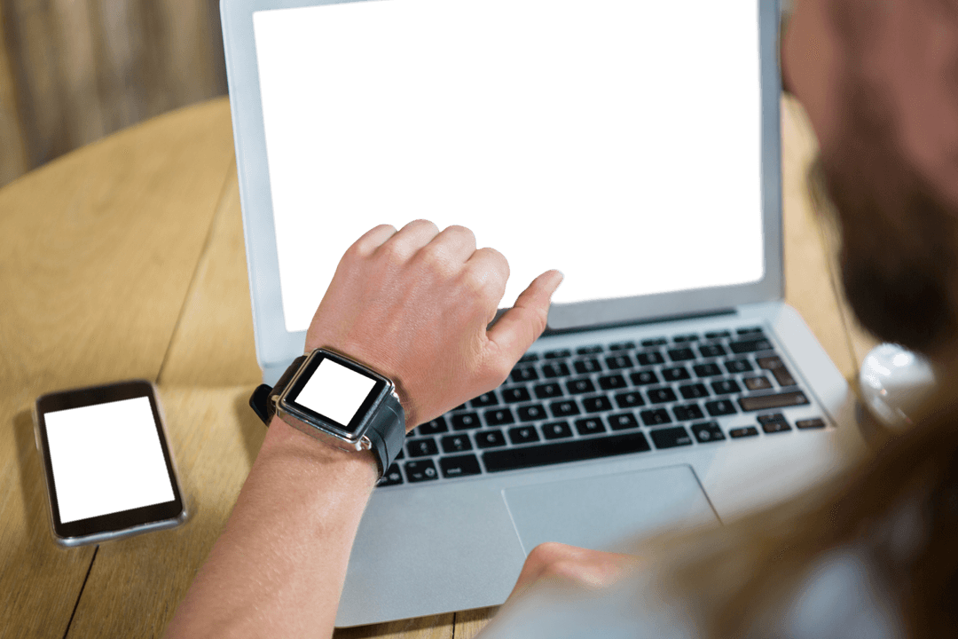 man using smart watch with laptop: transparent screens setup - Download Free Stock Images Pikwizard.com