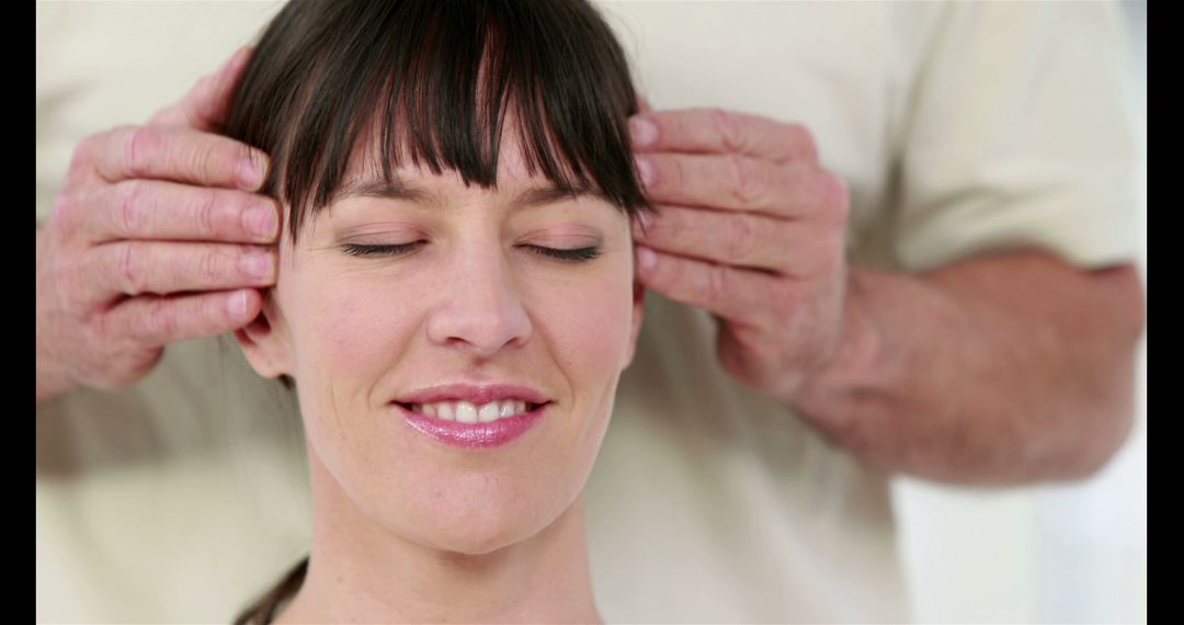 Man Giving Relaxing Head Massage to Smiling Woman at Home - Free Images, Stock Photos and Pictures on Pikwizard.com