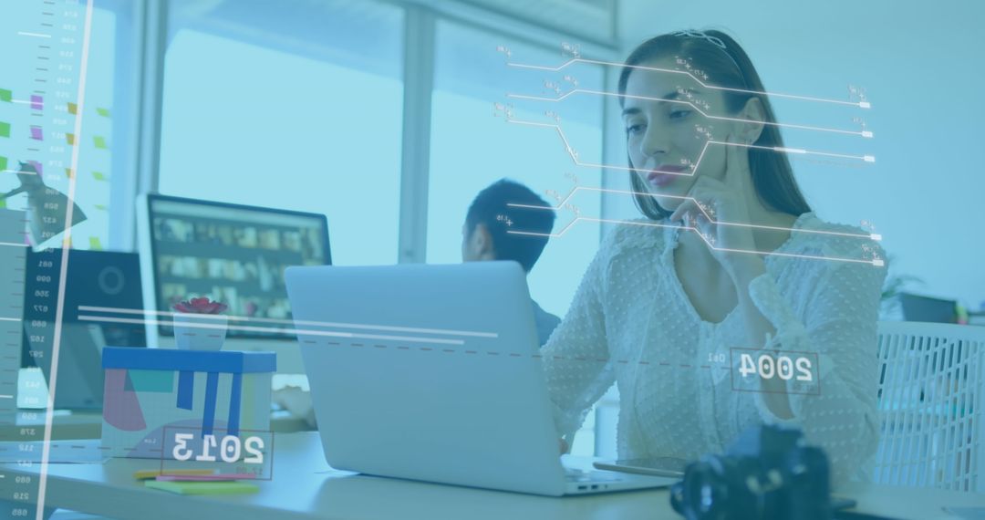 Futuristic Businesswoman Analyzing Financial Data on Laptop