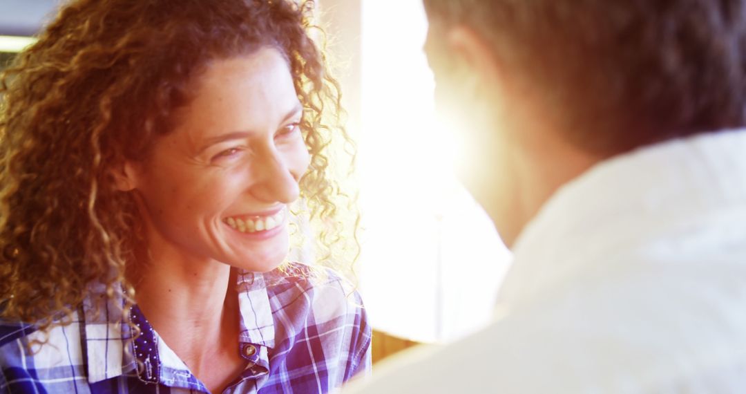 Smiling Woman Having Conversation in Bright Sunlight - Free Images, Stock Photos and Pictures on Pikwizard.com