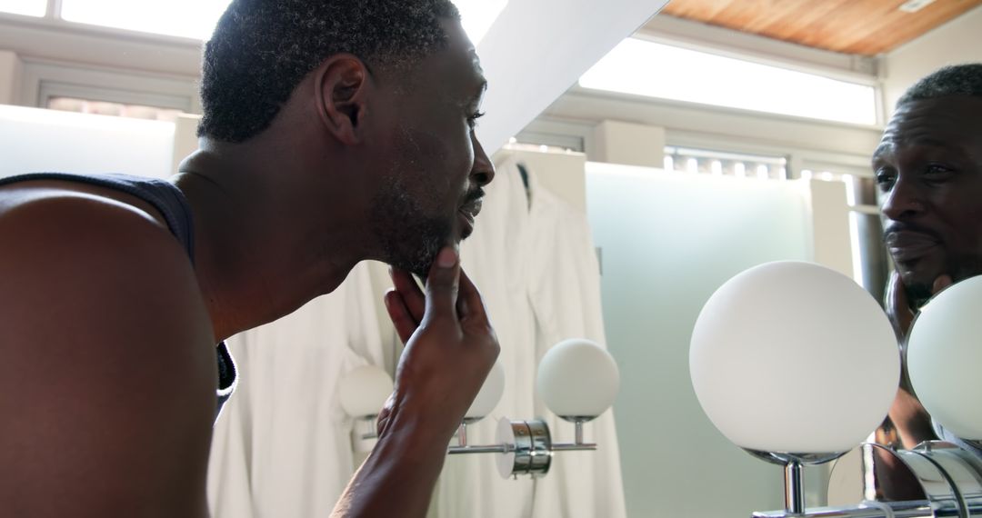 Man Grooming Beard in Modern Bathroom Mirror Reflection ritual