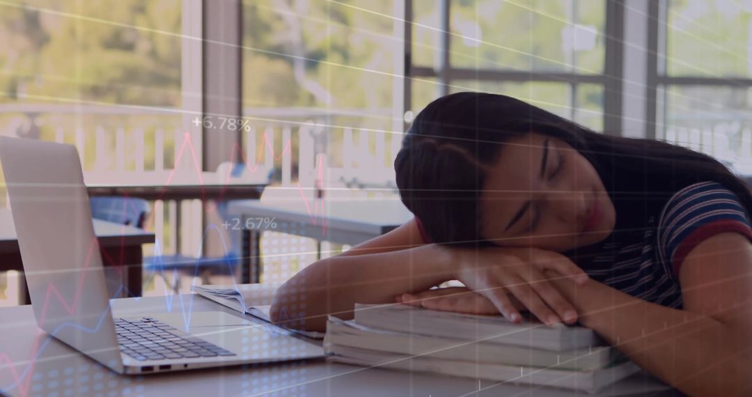 Teen Falling Asleep on Textbooks in Study Area