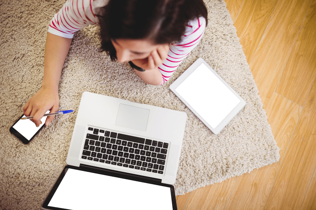 Woman Enjoying Tech Gadgets on Warm Rug