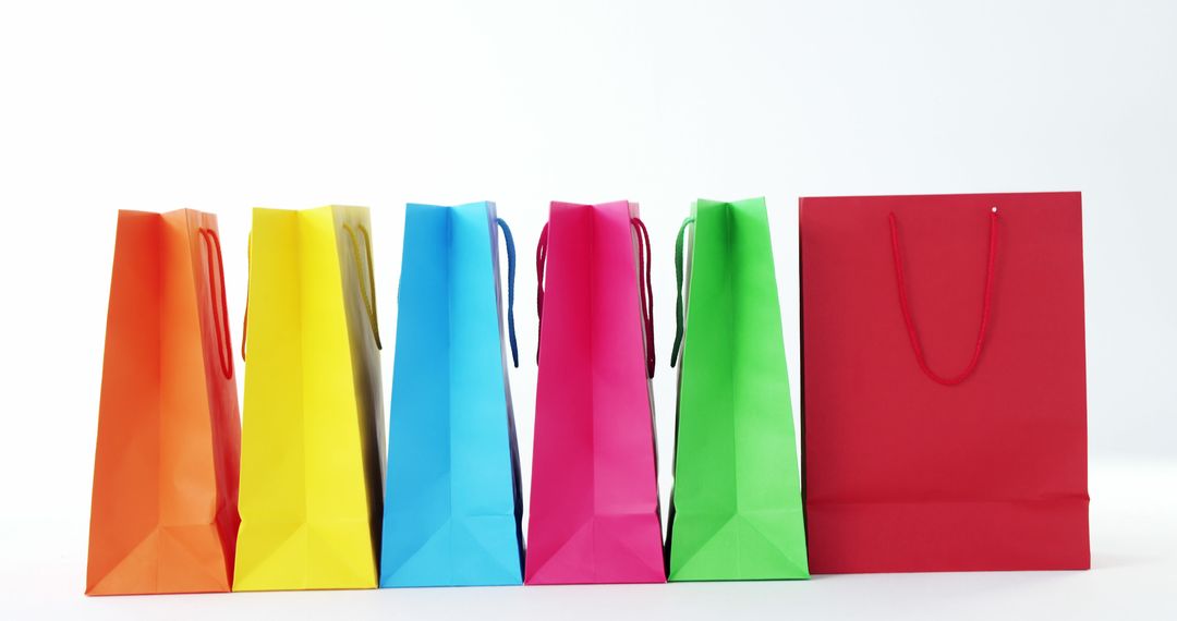 Colorful Shopping Bags Against White Background - Free Images, Stock Photos and Pictures on Pikwizard.com