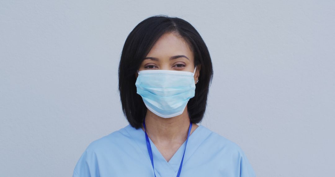 Healthcare Worker Wearing Surgical Mask and Scrubs - Free Images, Stock Photos and Pictures on Pikwizard.com